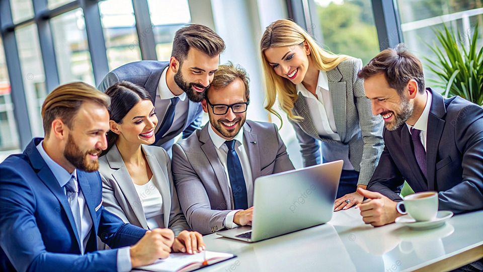 Startup team celebrating results around a laptop